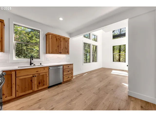 a bathroom with a sink windows and a bathtub