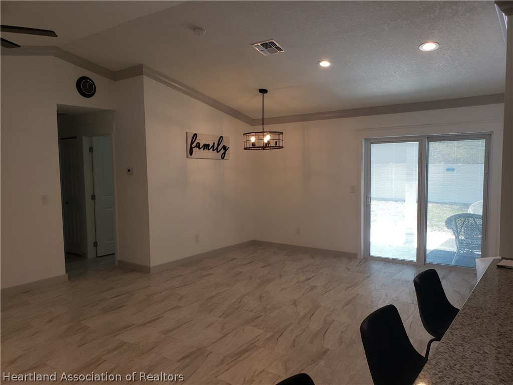 2247 West Longbottom Road Avon Park, FL 33825 - Photo 2 of 21 a view of an empty room with a window