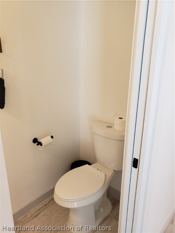 2247 West Longbottom Road Avon Park, FL 33825 - Photo 9 of 21 a white toilet sitting next to a shower