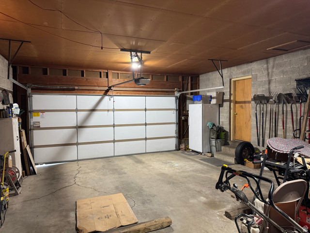 1611 South 75 East Bountiful, UT 84010 - Photo 22 of 23 Attached white panel garage door with automatic opener
