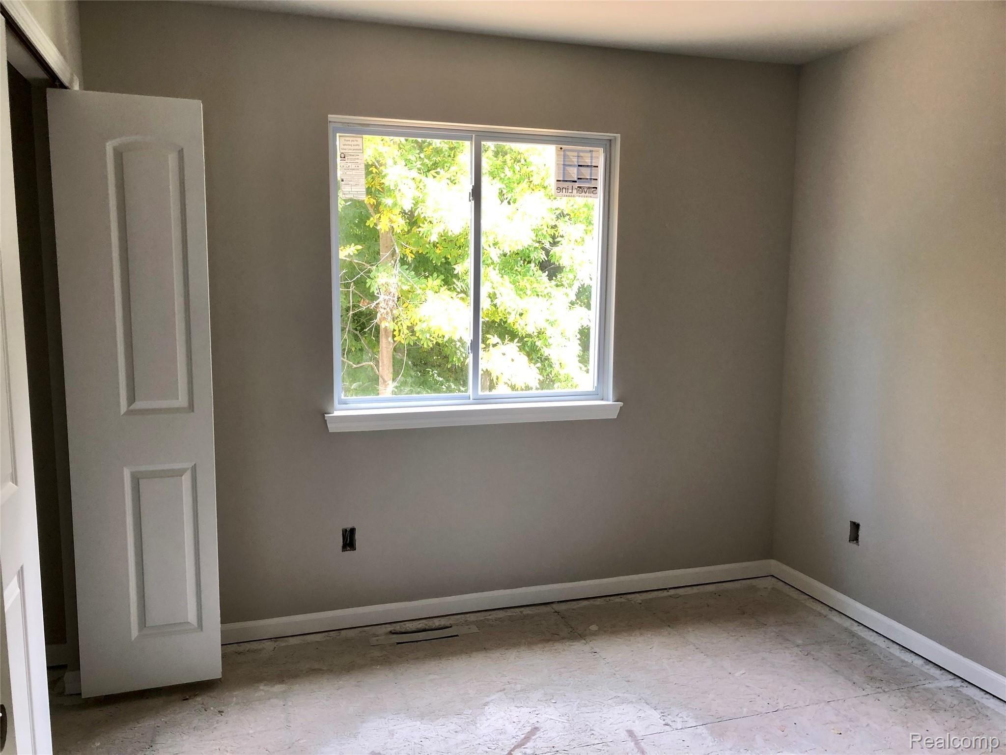 13357 Stamford Road Belleville, MI 48111 - Photo 15 of 18 Rear Middle Bedroom