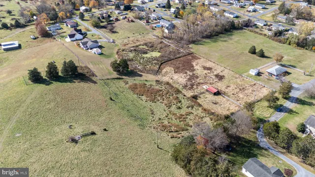 a view of a town with mountains in the background
