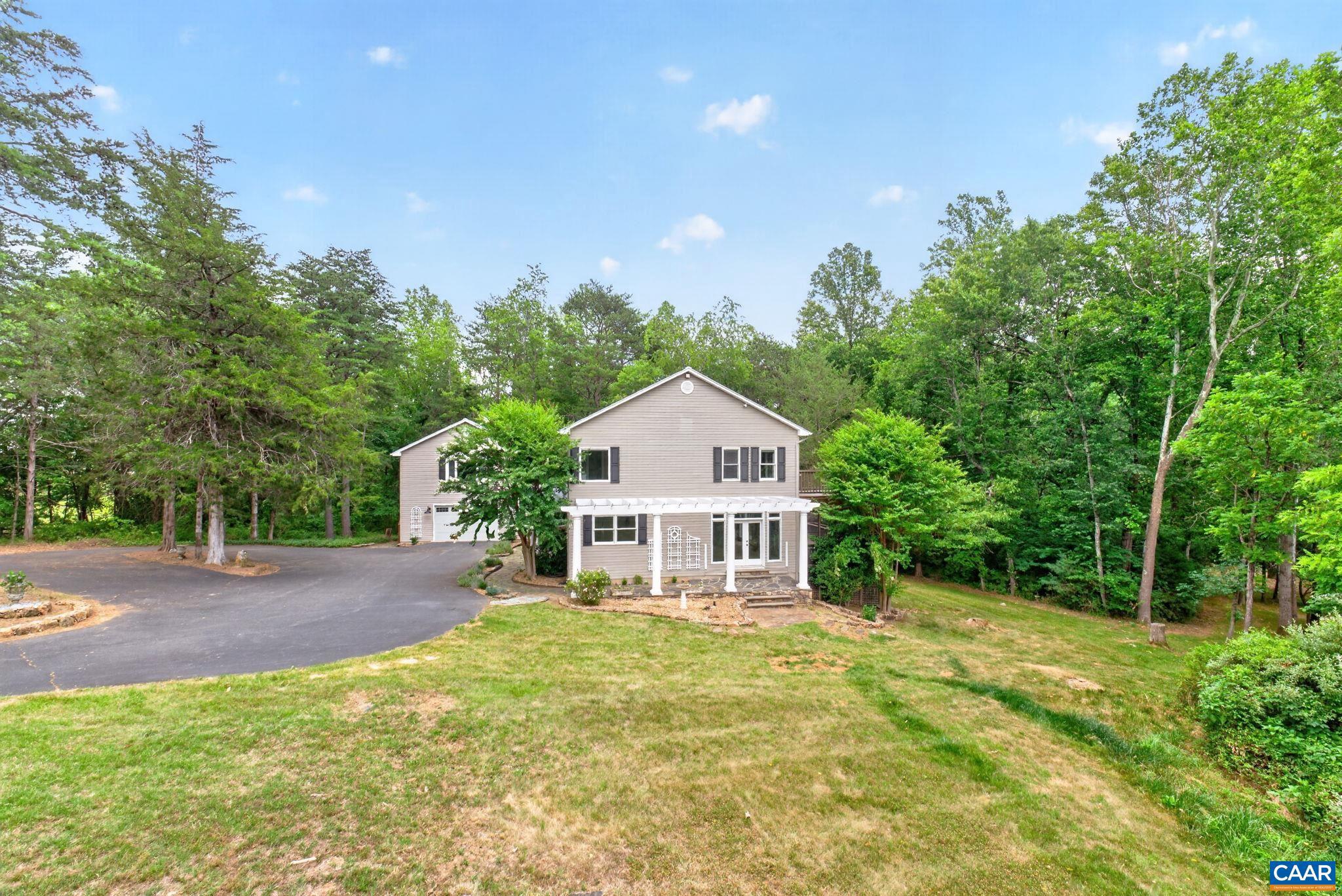6285 Jarmans Gap Road Crozet, VA 22932 - Photo 63 of 65 a house view with a garden space