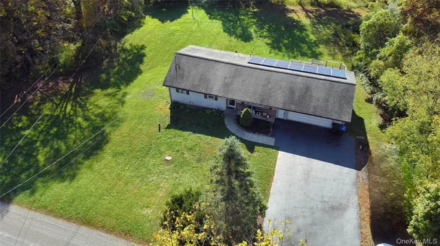 a backyard of a house with lots of green space