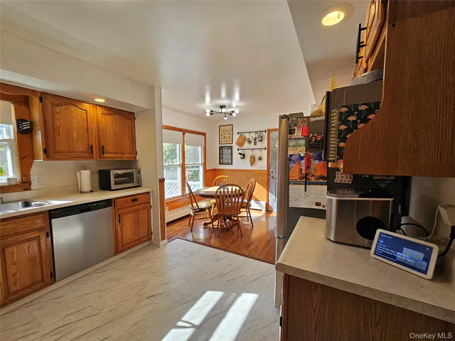 a kitchen with stainless steel appliances granite countertop a refrigerator and stove top oven