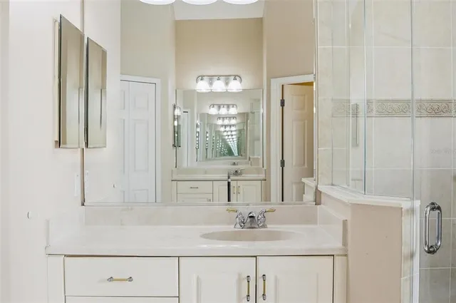 a view of an empty room with window and closet area