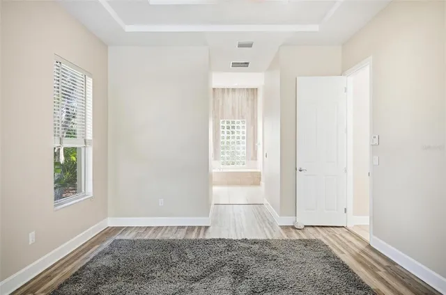 an aerial view of residential building and lake