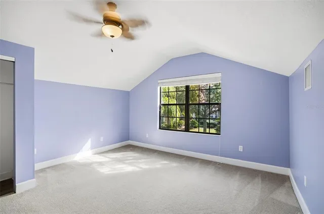 a view of a chairs and table on the wooden roof deck