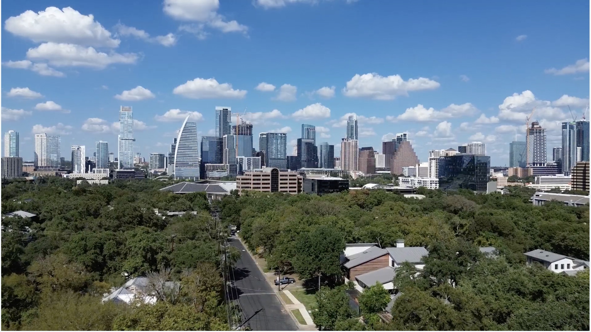 809 Bouldin Avenue Austin, TX 78704 - Photo 2 of 39 View of city skyline with a tree filled landscape