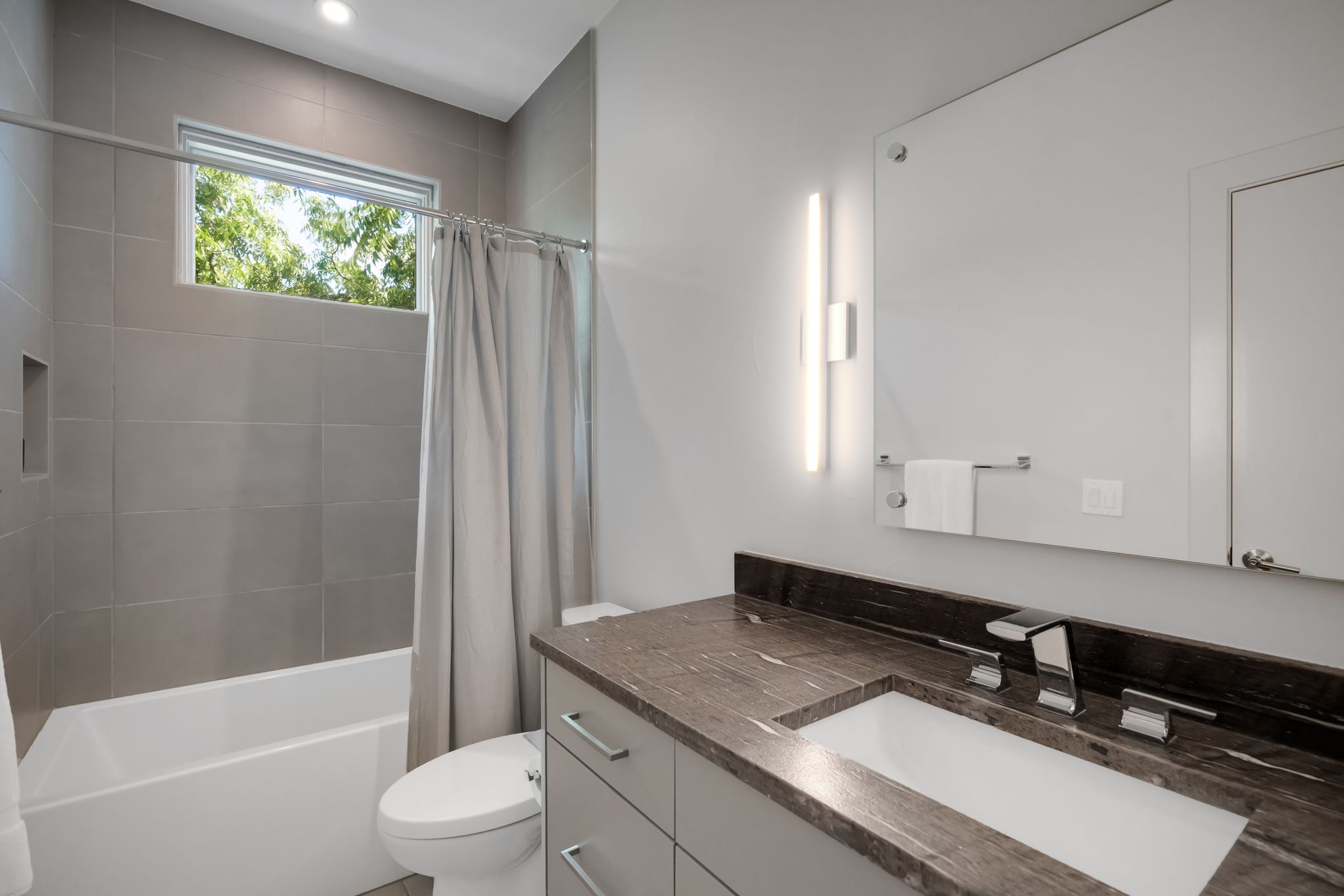 809 Bouldin Avenue Austin, TX 78704 - Photo 21 of 39 Full bathroom featuring vanity and shower / bath combination with curtain