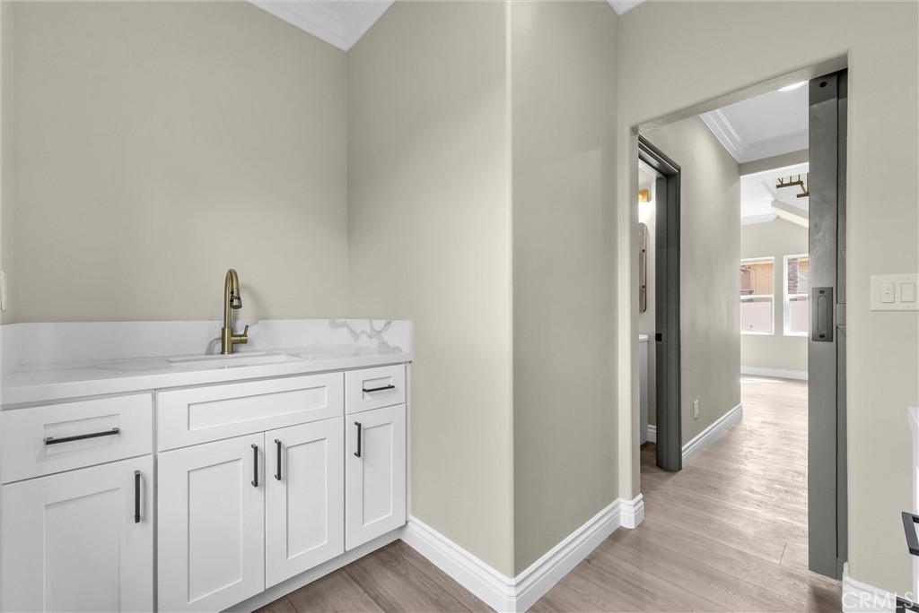 14388 Dove Canyon Drive Riverside, CA 92503 - Photo 13 of 38 a kitchen with white cabinets and sink