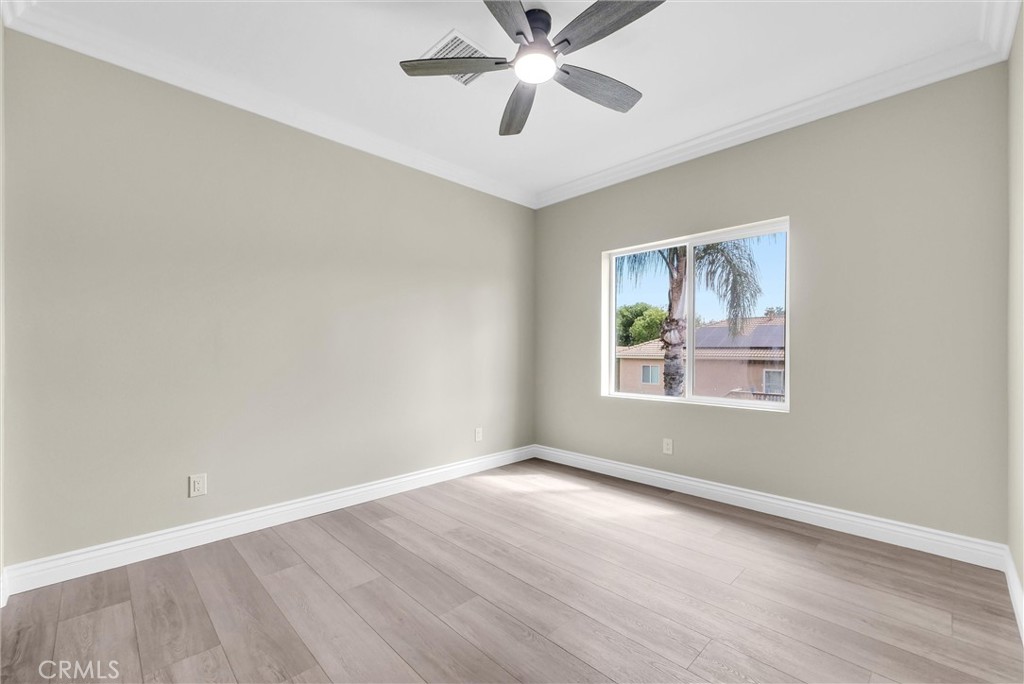 14388 Dove Canyon Drive Riverside, CA 92503 - Photo 20 of 38 wooden floor in an empty room with a window