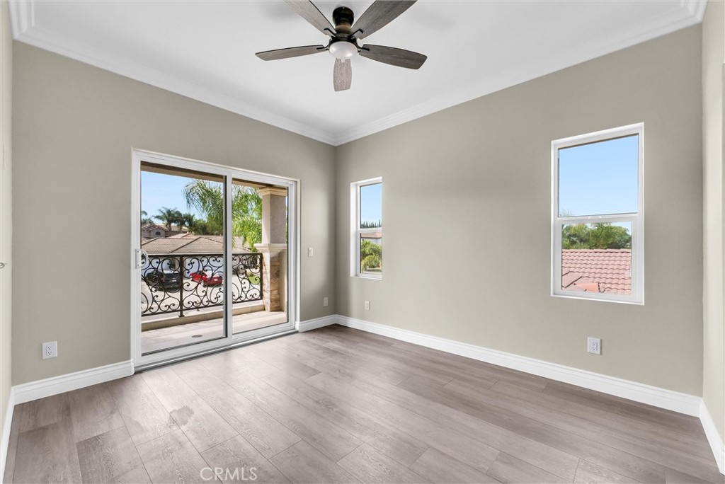 14388 Dove Canyon Drive Riverside, CA 92503 - Photo 22 of 38 wooden floor in an empty room with a window