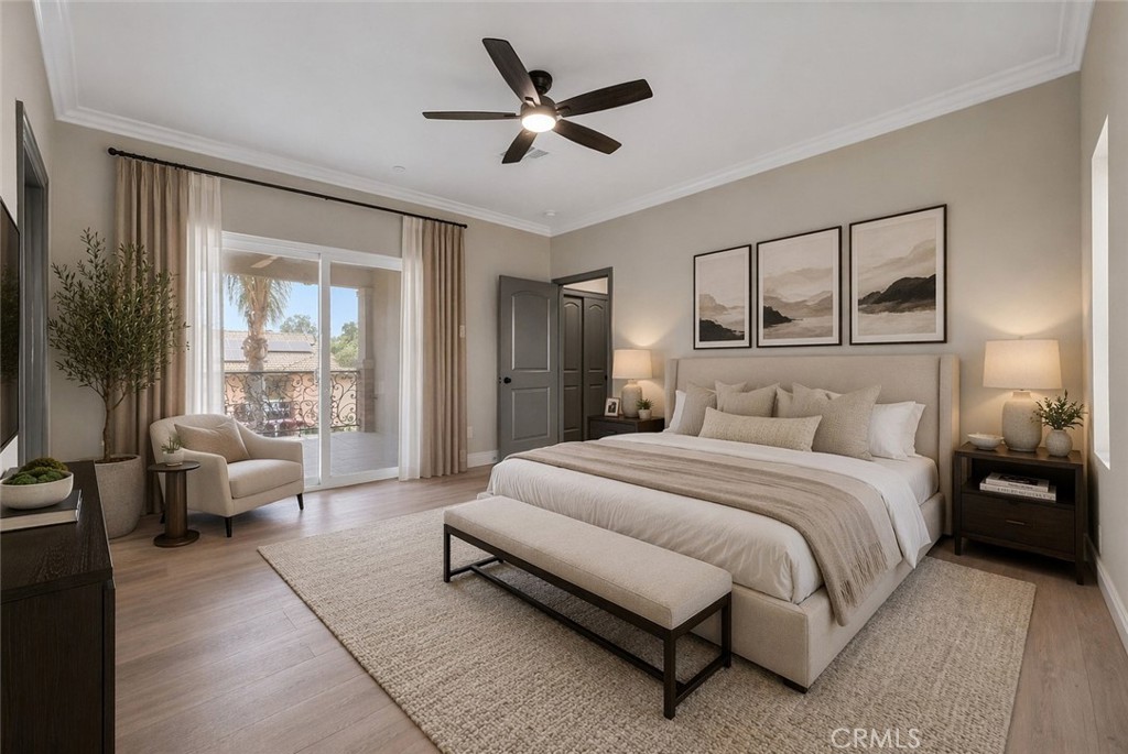 14388 Dove Canyon Drive Riverside, CA 92503 - Photo 25 of 38 a spacious bedroom with a bed couch and a large window