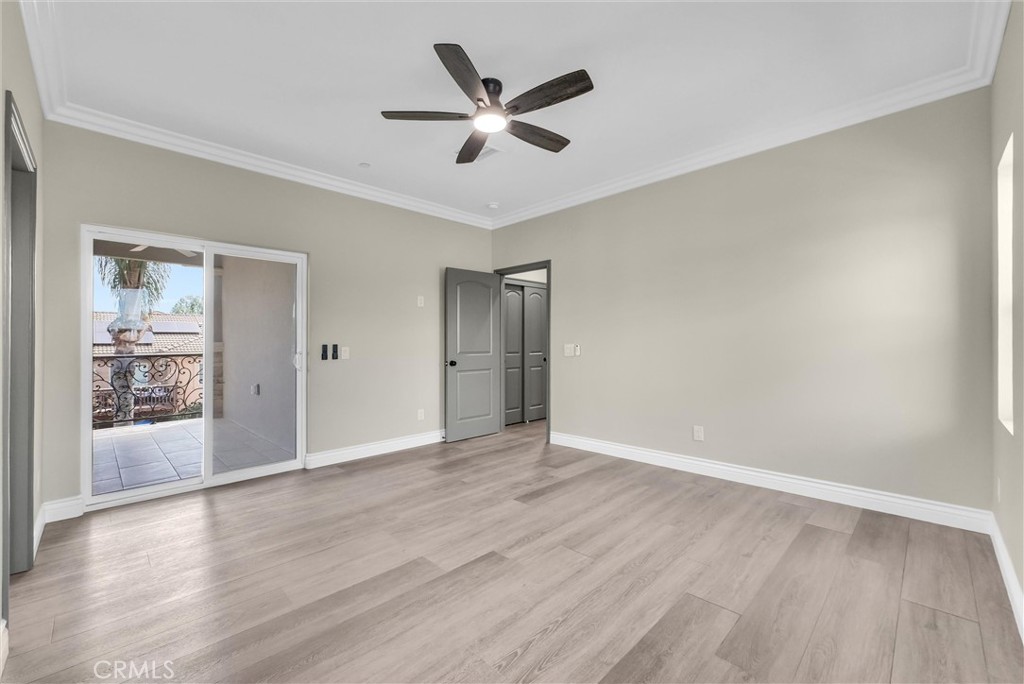 14388 Dove Canyon Drive Riverside, CA 92503 - Photo 26 of 38 an empty room with wooden floor and windows
