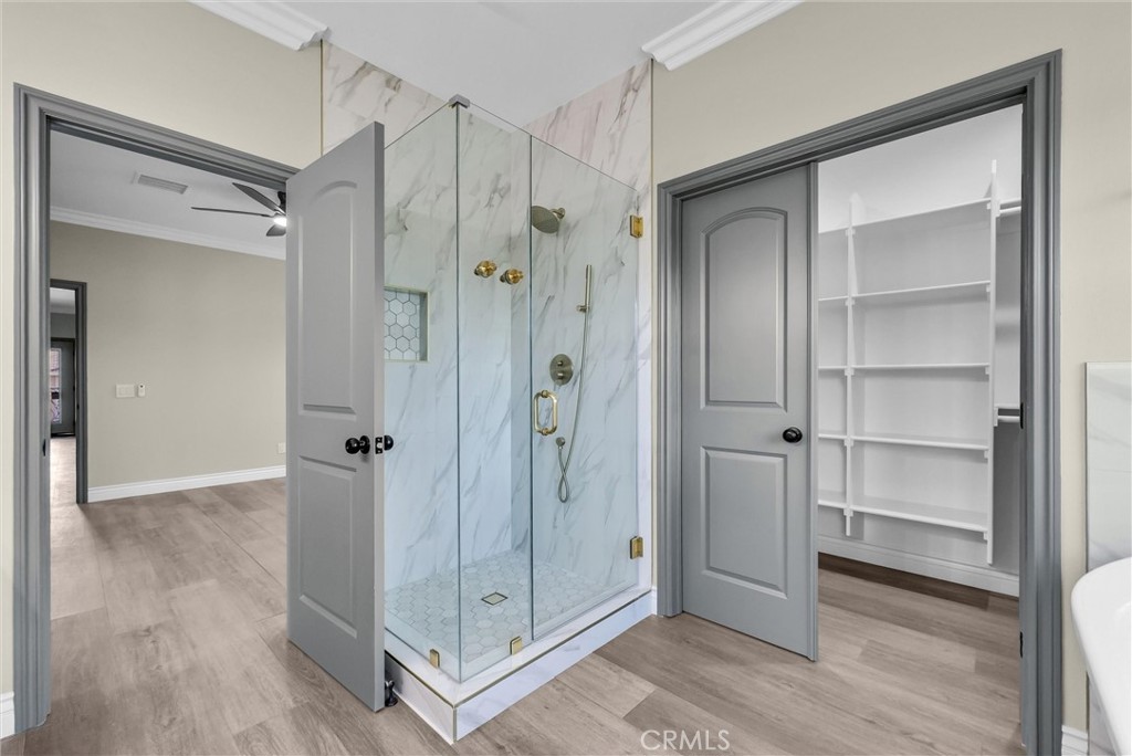 14388 Dove Canyon Drive Riverside, CA 92503 - Photo 31 of 38 a bathroom with a shower and a glass door