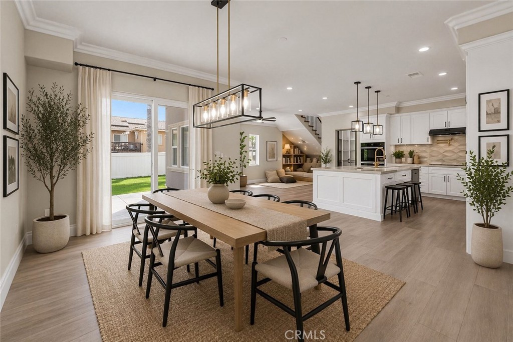 14388 Dove Canyon Drive Riverside, CA 92503 - Photo 7 of 38 a view of a dining room with furniture window and wooden floor