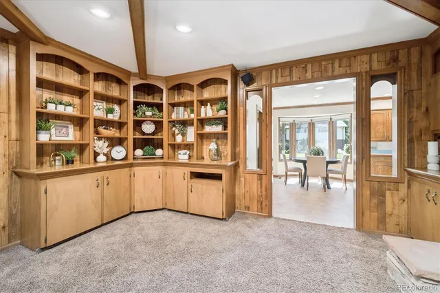 a kitchen with stainless steel appliances granite countertop wooden cabinets a sink and a stove