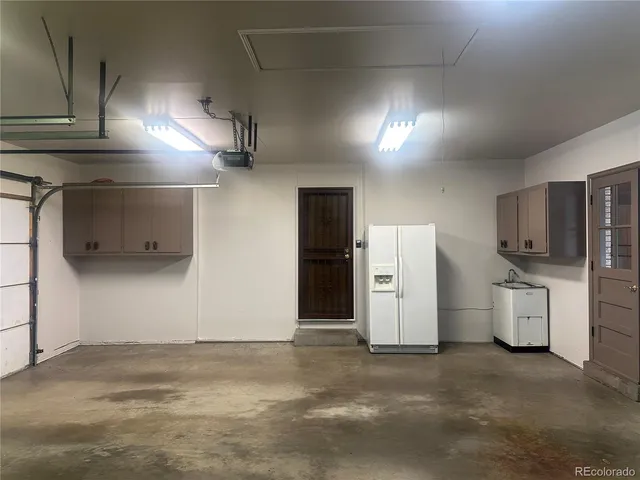 a view of a hallway with bedroom and front door