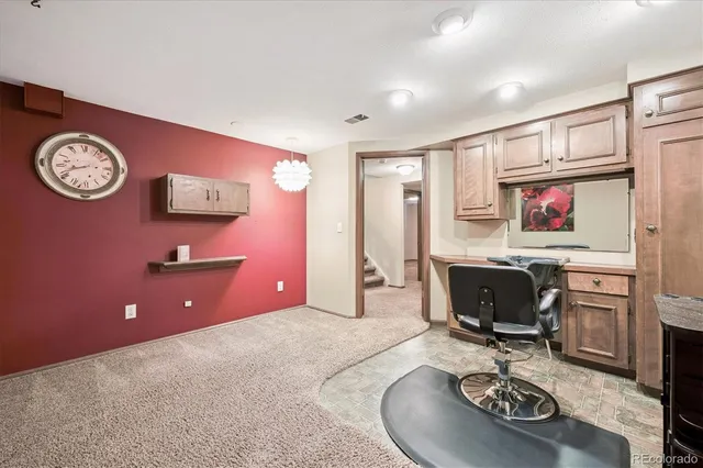 a living room with furniture a rug and a large window