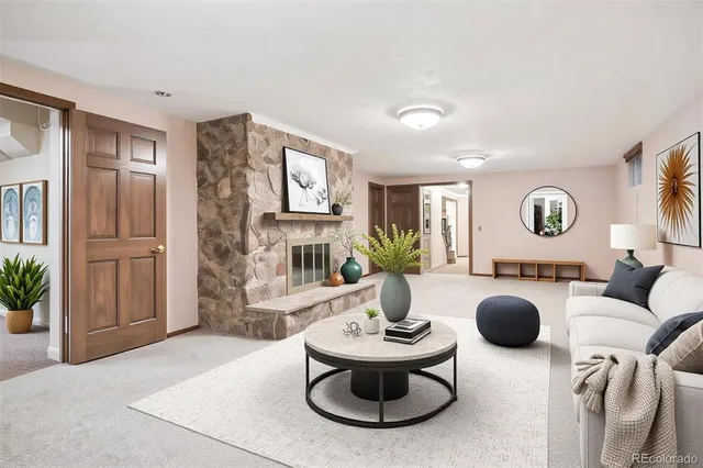 a view of a house with backyard and sitting area