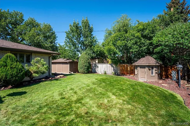 a room with furniture and a floor to ceiling window