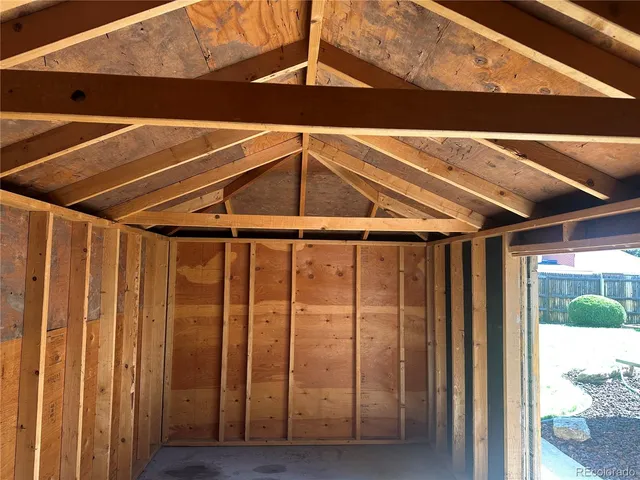 a view of a wooden deck and a yard