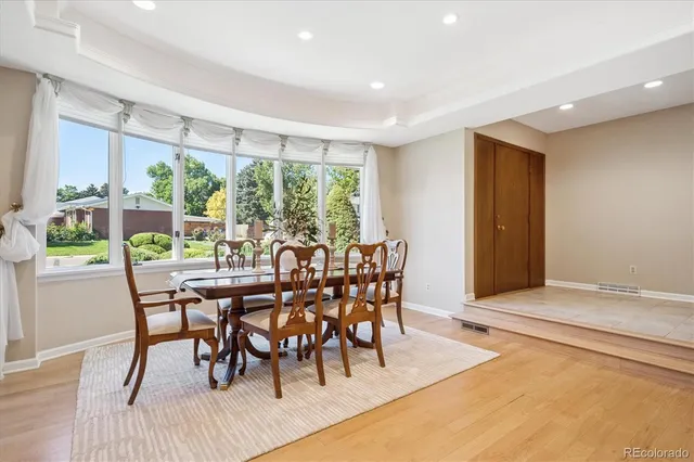 a view of a dining room with furniture window and outside view