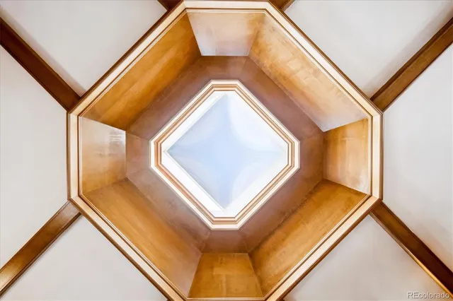 a living room with furniture a fireplace and next to a window