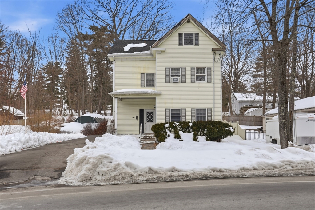 253 Main Street Amesbury, MA 01913 - Photo 2 of 10 a view of a house with snow on the road