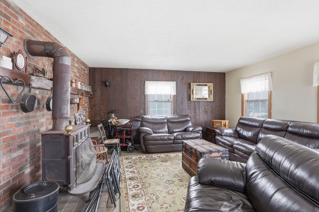 253 Main Street Amesbury, MA 01913 - Photo 5 of 10 a living room with furniture and a large window