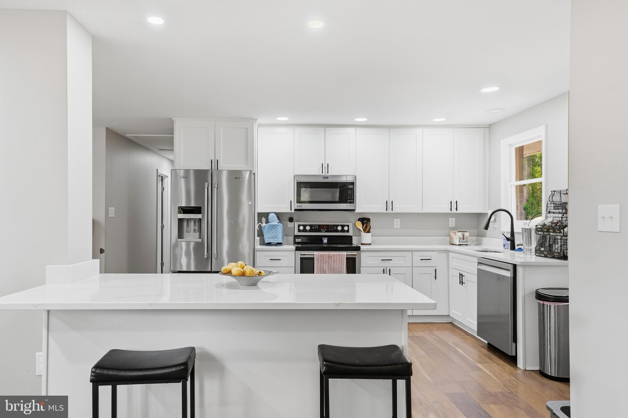 11450 Little Cove Point Road Lusby, MD 20657 - Photo 13 of 68 Kitchen island with additional seating