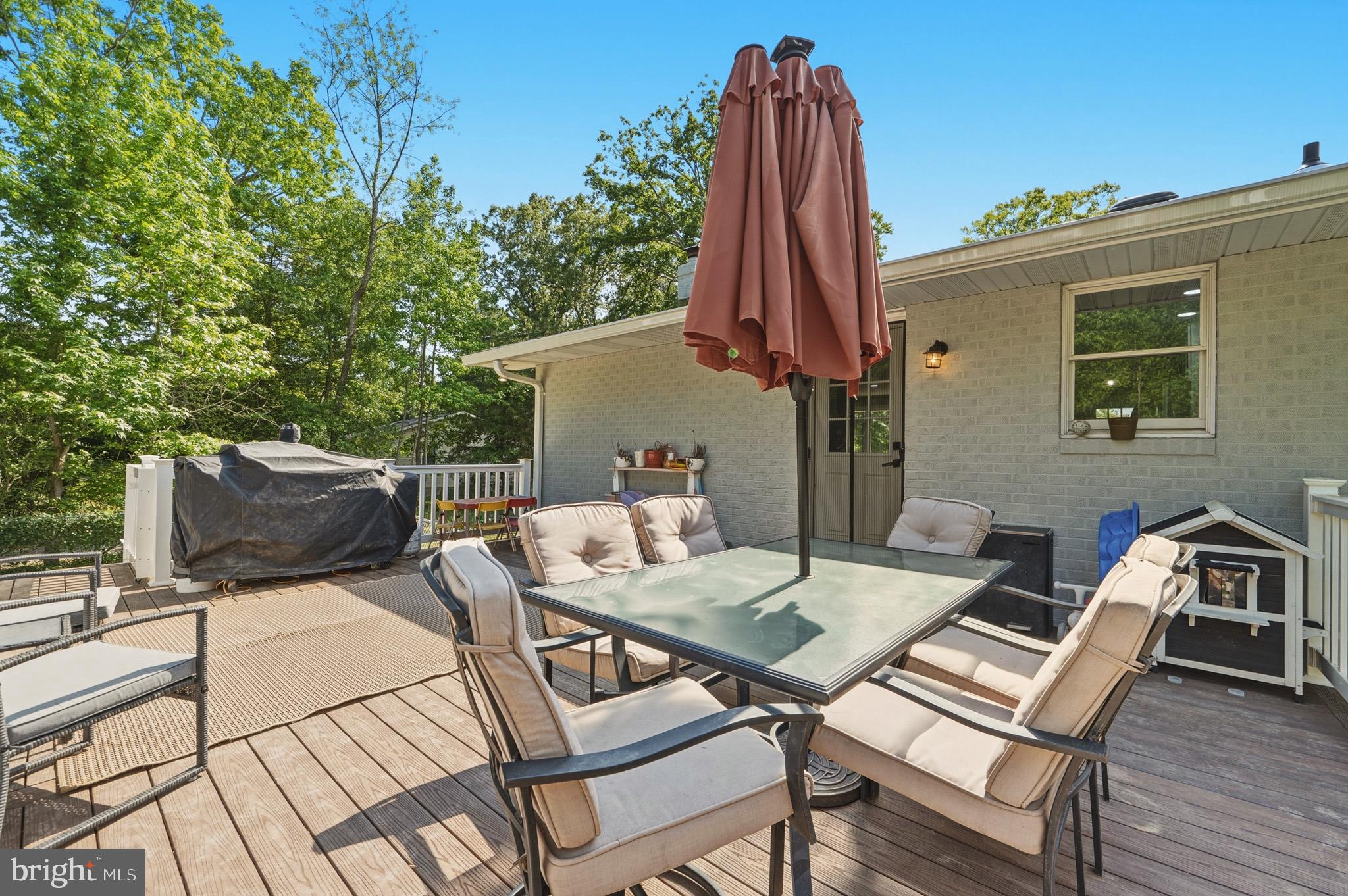 11450 Little Cove Point Road Lusby, MD 20657 - Photo 22 of 68 Deck w/ steps down to yard