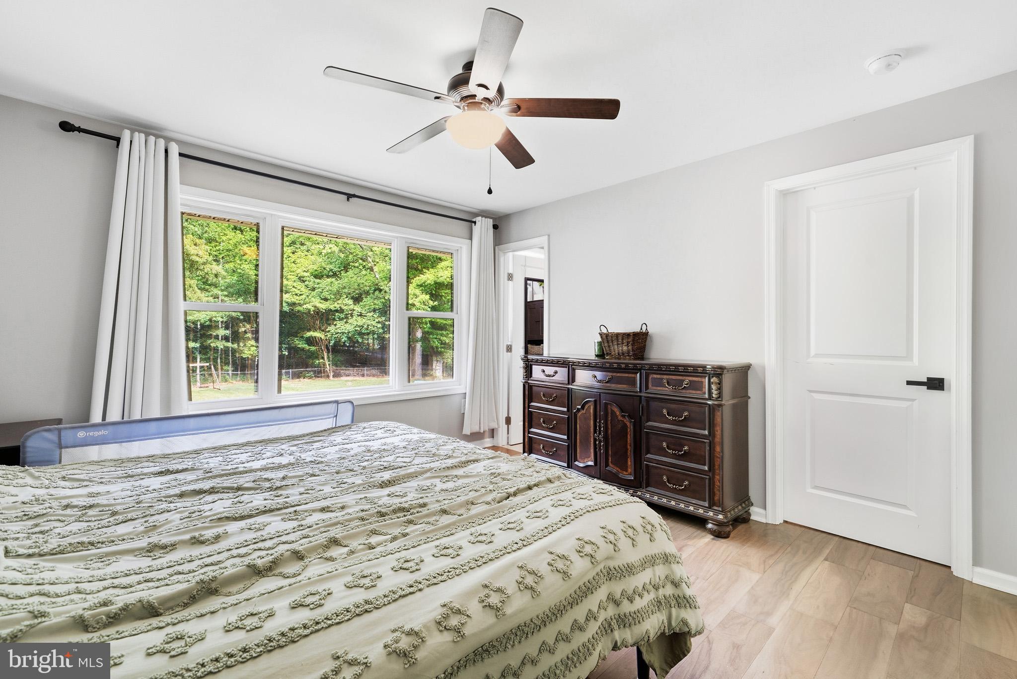 11450 Little Cove Point Road Lusby, MD 20657 - Photo 25 of 68 Primary bedroom with tons of natural light