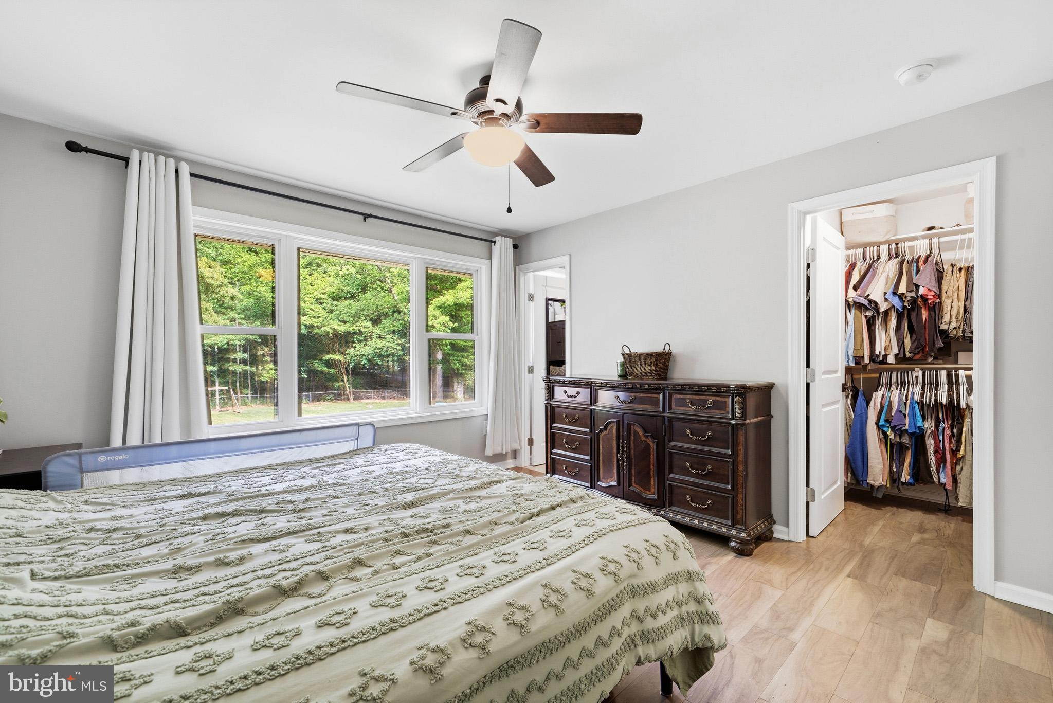 11450 Little Cove Point Road Lusby, MD 20657 - Photo 26 of 68 Primary bedroom w/ walk-in closet