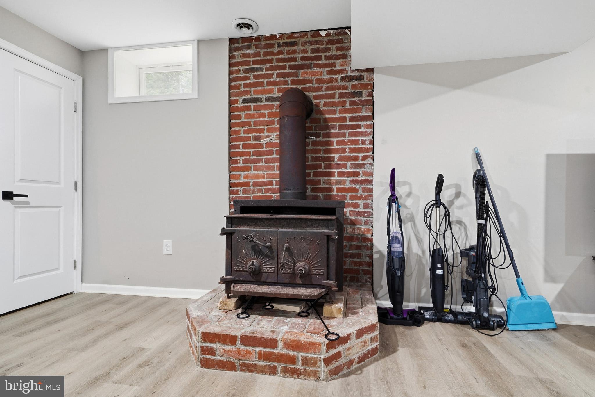 11450 Little Cove Point Road Lusby, MD 20657 - Photo 42 of 68 Basement with wood-burning FP