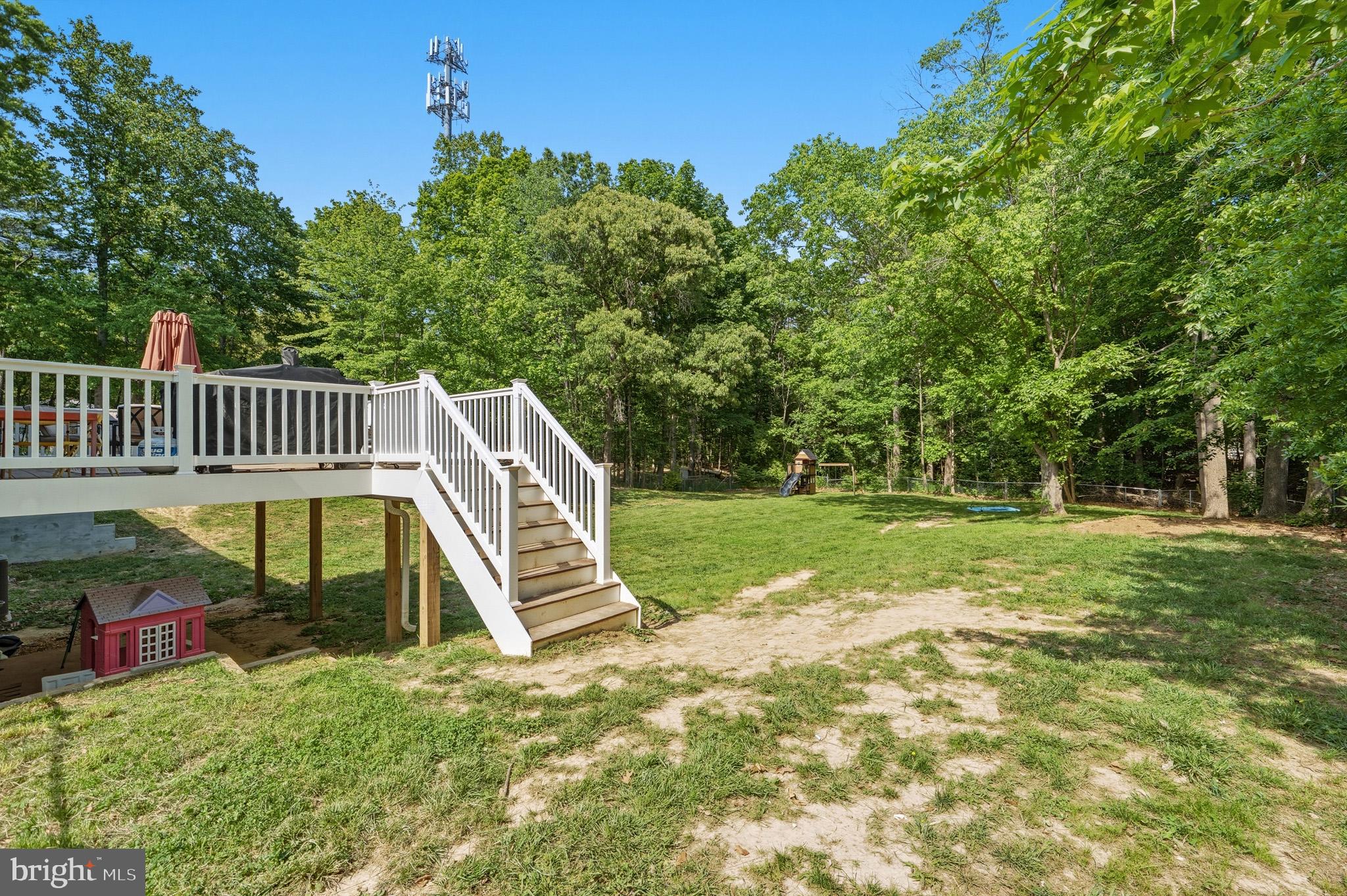 11450 Little Cove Point Road Lusby, MD 20657 - Photo 49 of 68 Deck with steps down to backyard