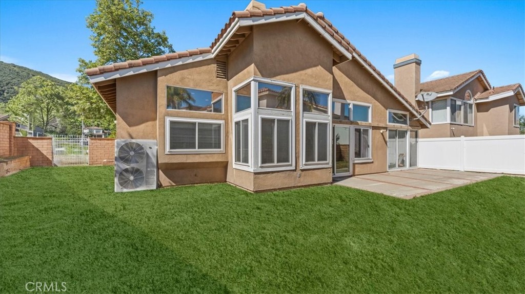 1671 Dominguez Ranch Road Corona, CA 92878 - Photo 30 of 42 his outdoor space includes a concrete patio, grassy area, and direct access to the home, creating a functional extension of the living space.his outdoor space includes a concrete patio, grassy area, and direct access to the home, creating a functional extension of the living space.