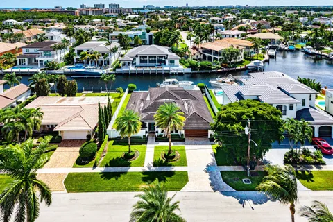 an aerial view of a house with a lake view