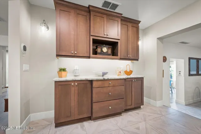 a view of a dining room that has a table and chairs