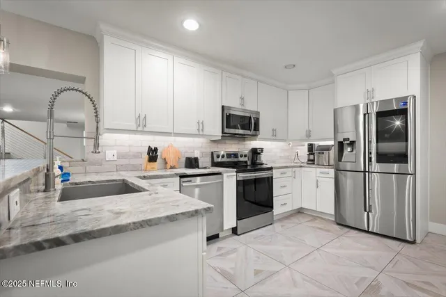 a utility room with washer and dryer