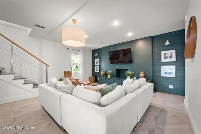 a living room with furniture and a window