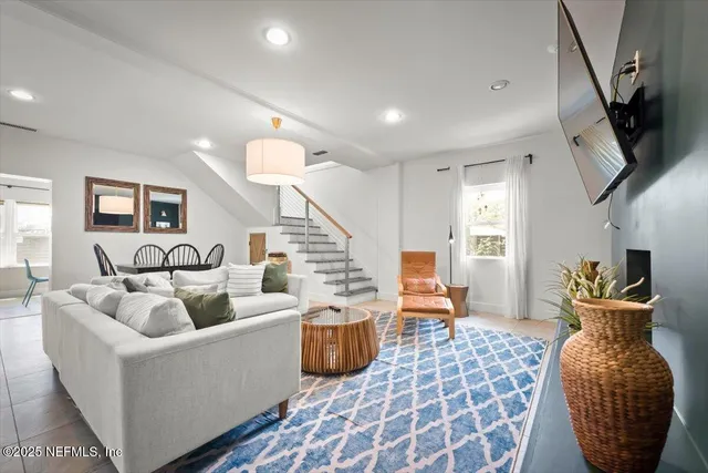 a view of a dining room with furniture window and outside view