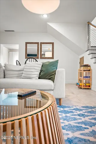 a patio with yard glass top table and chairs