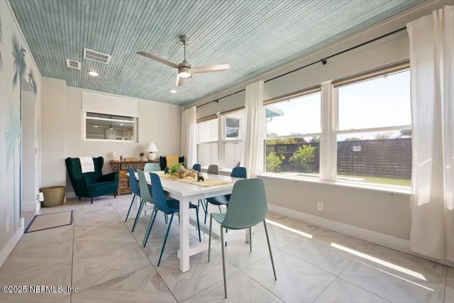 a bedroom with furniture and wooden floor