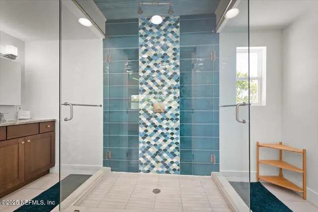 a bedroom with a bed and a wooden floor