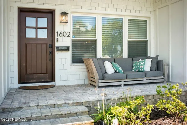 a living room with furniture and a rug