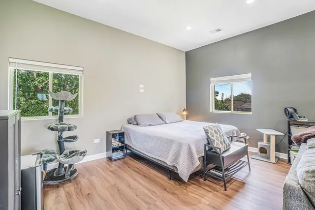 a bedroom with a bed and a table in it