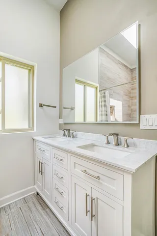 a bathroom with a sink and a mirror