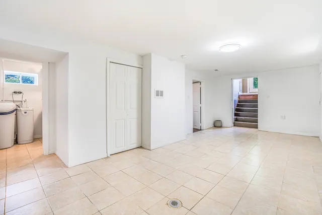 a view of a storage & utility room with a sink